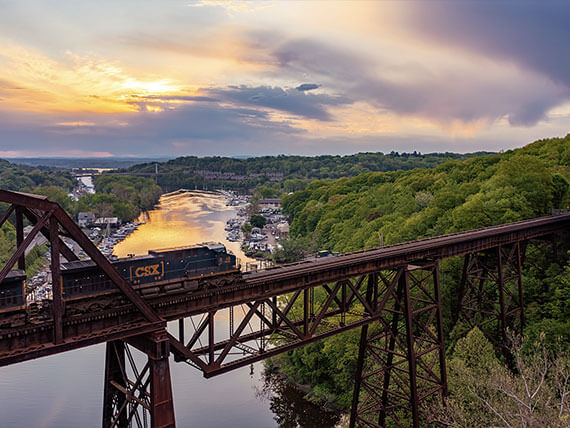 A train crossing a trestle bridge over the Hudson River